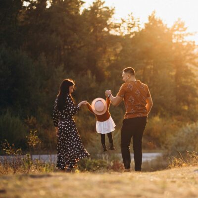 family-with-their-little-daughter-in-an-autumn-field-scaled-400x400